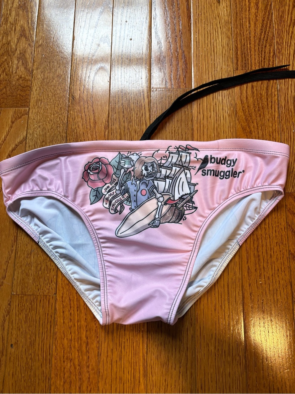 Jake Ross x Budgy Smuggler Men’s Pink swim brief with skater tattoo art